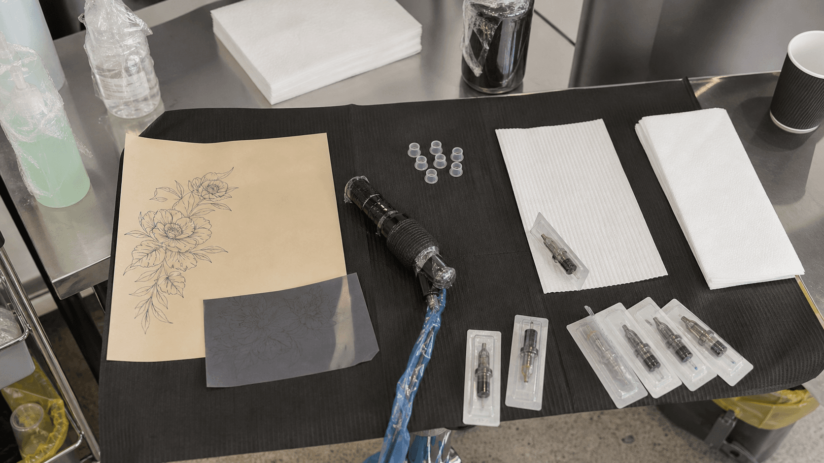 A professional tattoo workstation arranged in a clean-to-dirty workflow